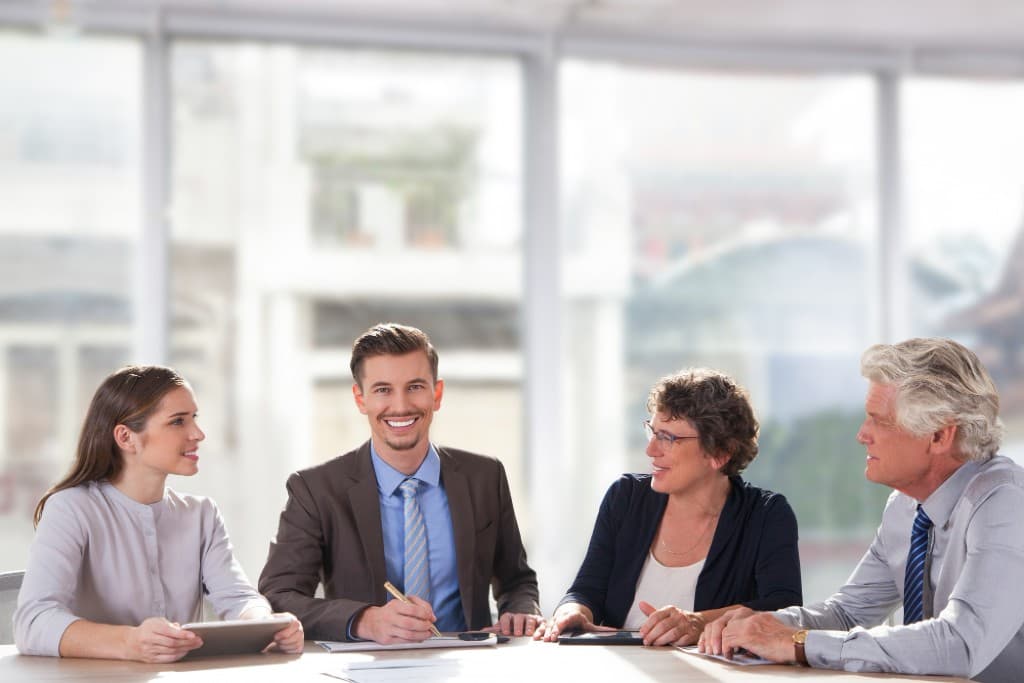 Professionals collaborating around a conference table
